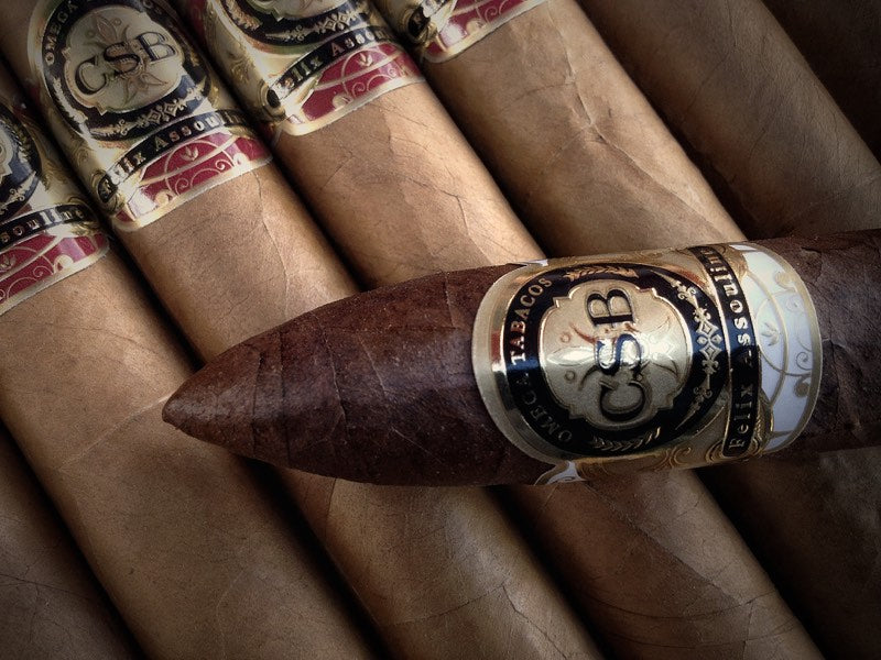A CSB Salva Vida torpedo across a row of CSB cigars