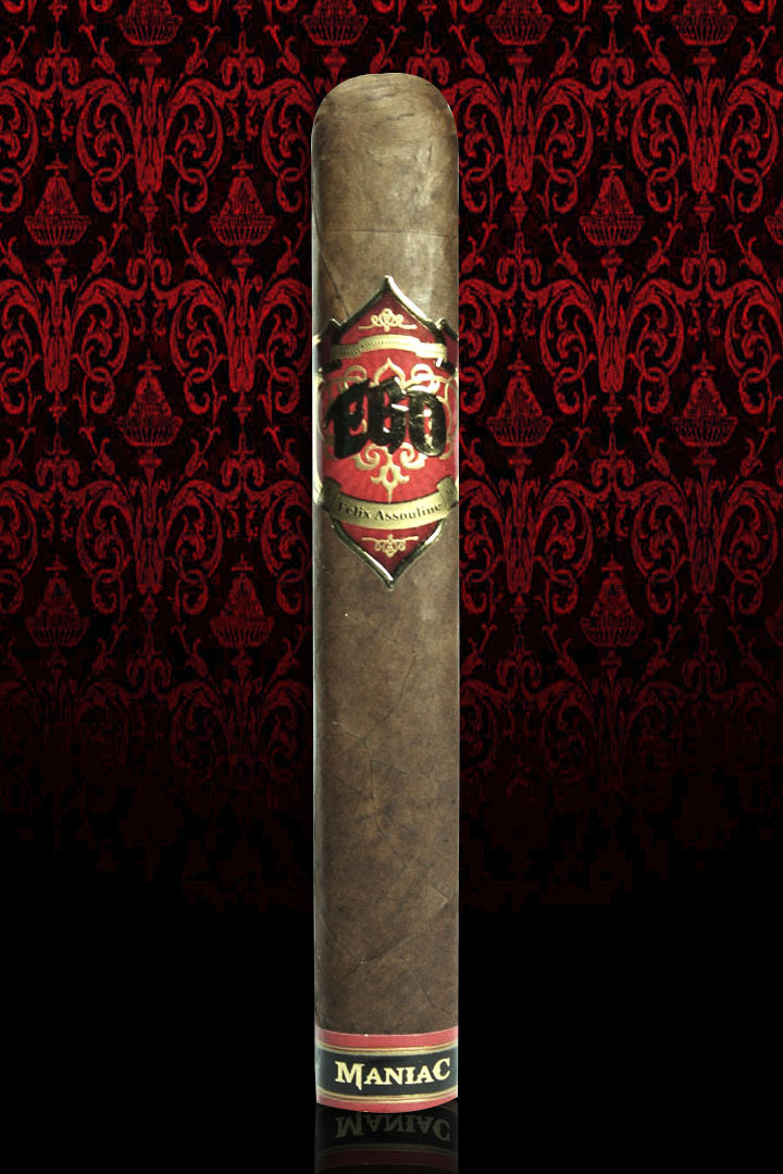 A single EGO Red Maniac standing against red damask