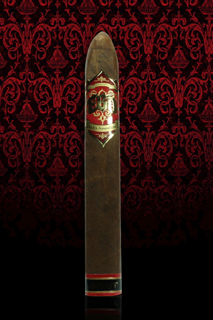 A single EGO Red Spirit belicoso standing against red damask