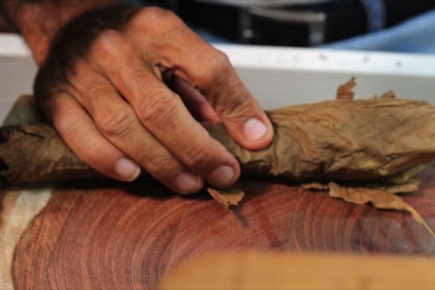 A bunch being rolled on the cedar board