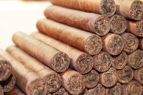 Finished cigars stacked in bundles