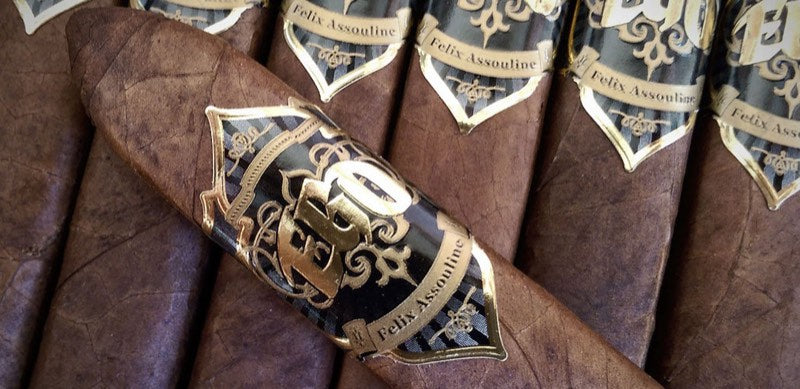EGO Black cigars laid in a row, one turned to show its black-and-gold shield band