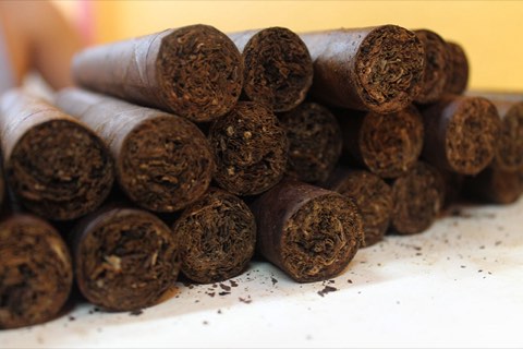Finished cigars stacked feet forward