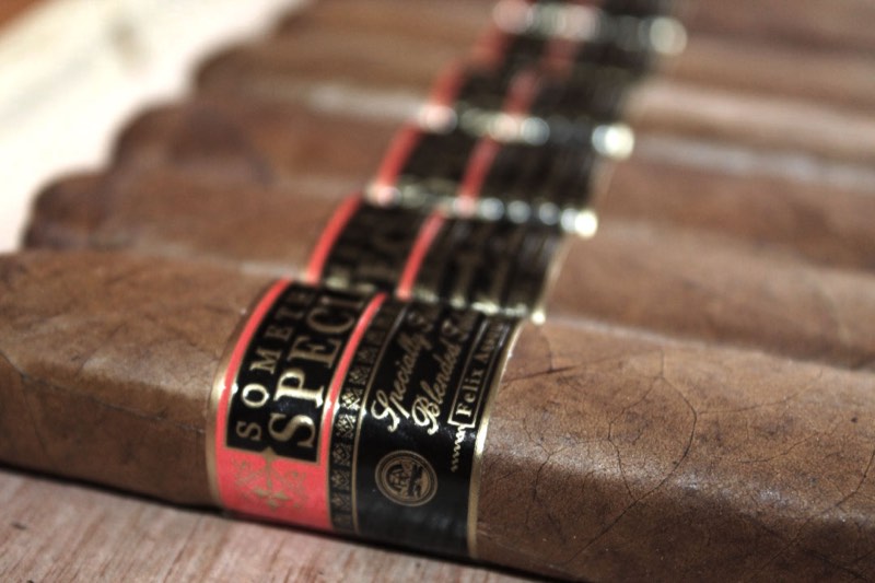 Something Special cigars with red-and-black bands, bundled