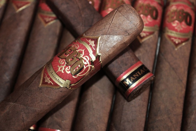 EGO Red cigars with red-and-gold bands, one laid across the box